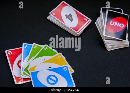 Kiev, Ukraine - 10.03.2021 Playing cards UNO on black Table games. Pastime. Board games. Stay home leisure activity for kids family. Stock Photo