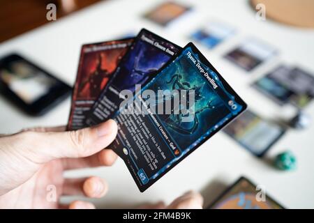 Bangkok, Thailand - May 6, 2021 : A man playing Magic The Gathering card  game with mythic rare card. Mythic rare is a rarity level of the card Stock  Photo - Alamy