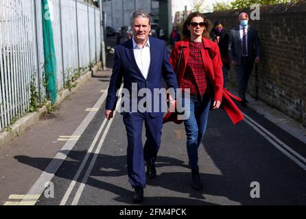 Britain's Labour Party leader Keir Starmer and his wife Victoria walk after casting a vote during local elections, in London, Britain May 6, 2021. REUTERS/Tom Nicholson