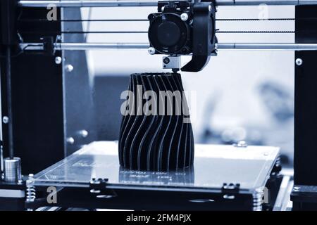 The process of working 3D printer and creating a three-dimensional object Stock Photo