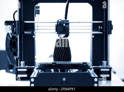 The process of working 3D printer and creating a three-dimensional object Stock Photo