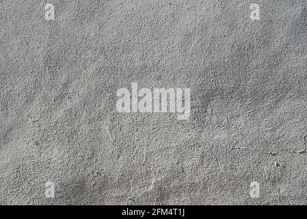 Heavily textured white and grey external plastered wall Stock Photo