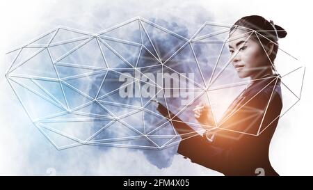 Double exposure of businesswoman holding tablet connect world Stock Photo