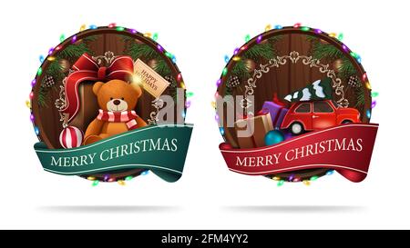 Christmas signs in the shape of a wooden barrel with a greeting ribbon and Christmas icons isolated on a white background Stock Photo