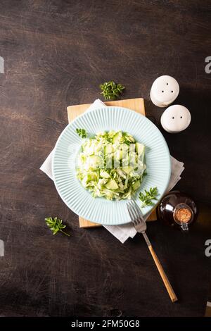 Healthy salad. Detox Spring vegan salad with cabbage, cucumber, green onion and parsley Stock Photo