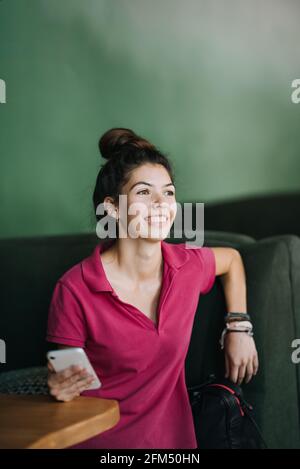 Mental health services, Online therapist-led emotional fitness classes and one-on-one therapy. Young Latina woman using Mental Health Apps on cell Stock Photo