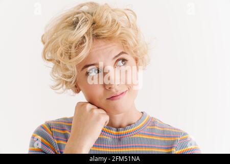 Image of blonde pleased woman thinking and looking upward isolated over ...