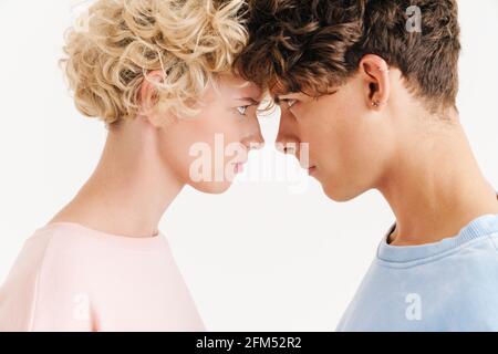 Image of young loving couple posing isolated over white background looking at each other Stock Photo
