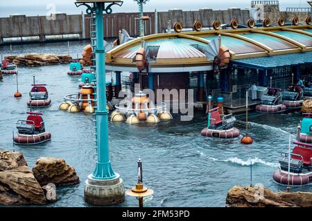 URAYASU, CHIBA, JAPAN - Sep 25, 2020: A distant shot of the Aquatopia ride in the Port Discovery Attraction Area of Tokyo Disney Sea in Urayasu, Chiba Stock Photo