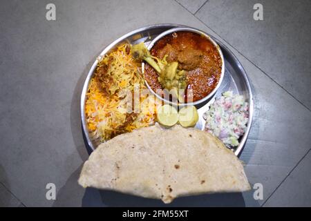 Maharashtian chicken curry with biryani  thali Stock Photo