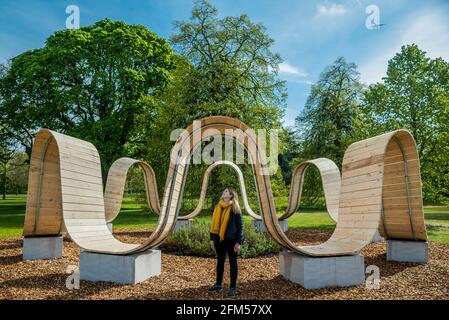 London, UK. 6 May 2021. Designer Paul Cocksedge's installation, Please Be Seated, takes the form of monumental and playful architectural seating, designed to encourage people to sit and reflect while taking in the relaxing scent of a specially planted rock rose circle - Secret World of Plants, an immersive summer festival, at Kew Gardens, explores ‘what do plants really mean to you?' Credit: Guy Bell/Alamy Live News Stock Photo