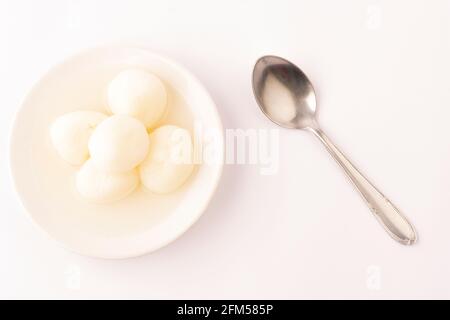 Rasgulla, Rasagola or Roshogolla is a South Asian syrupy dessert popular in the Indian subcontinent and regions with South Asian diaspora. It is made Stock Photo