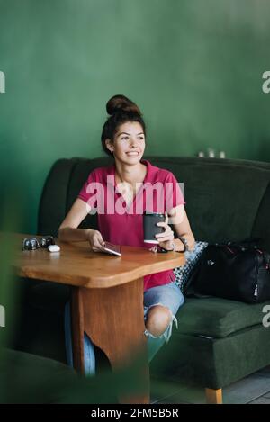 Mental health services, Online therapist-led emotional fitness classes and one-on-one therapy. Young Latina woman using Mental Health Apps on cell Stock Photo