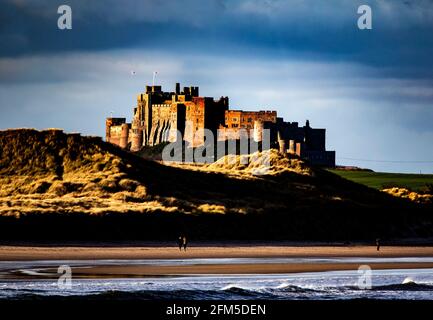 Bamburgh Castle from the harbor at Seahouses. Stock Photo