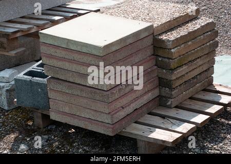 big paving stone blocks made of cement stored on a wooden pallet Stock Photo
