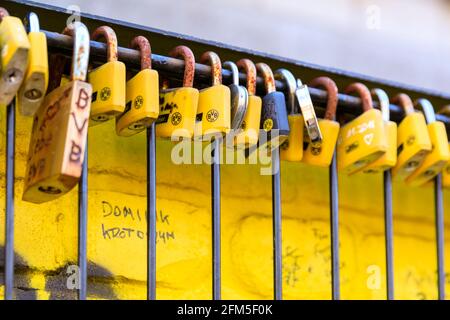 Love locks and fan locks padlocked to a 'Echte Liebe' (true love) fan wall also called 'wall of love' at Signal Iduna Park, Borussia Dortmund BVB 09