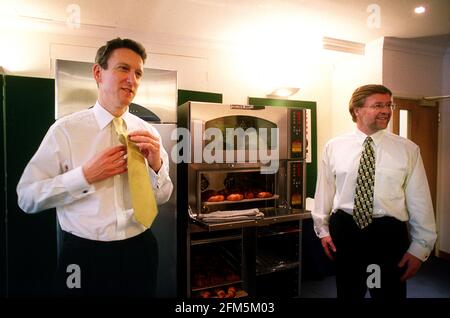 AGA Foodservices Group PLC Photocall March 2001 RIGHT Stephen Rennie Chief Operating Officer and  LEFT William McGrath Chief Executive use one of their ovens Stock Photo