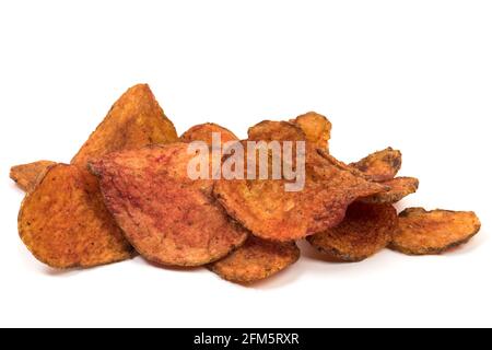 Heap of potato chips made of red potatoes isolated on white background Stock Photo