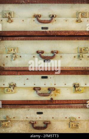 Pile of four antique weathered suitcases Stock Photo