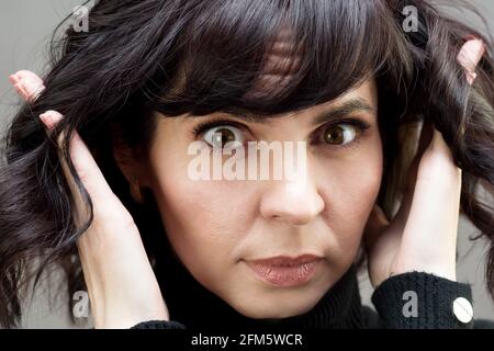 A woman with a piercing scary look. Close-up. Stock Photo