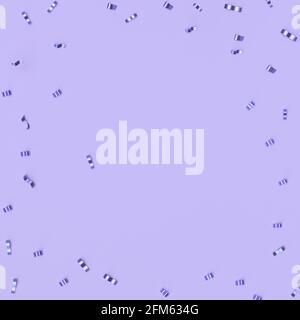Spurs on a trendy pastel purple background. Festive background with confetti. fashion concept. Stock Photo