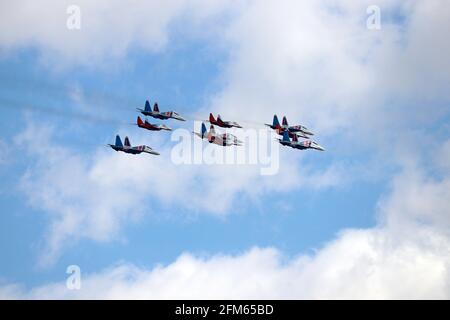 Russian Air Force jet fighters Mig-29 Fulcrum perform demonstration flight in the sky during rehearsing of Victory Parade Stock Photo