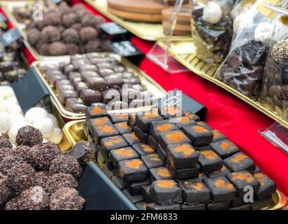 variety of chocolate bars in a row on the shelf Stock Photo