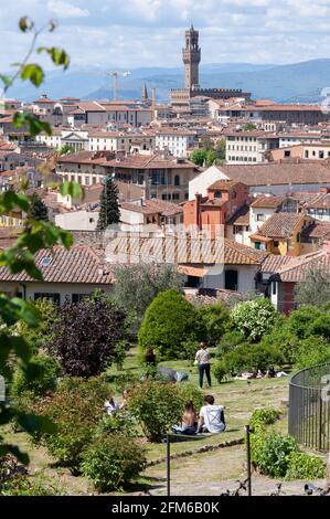 People at the Giardino delle Rose, sitting on the lawn, on a warm spring day.. Stock Photo