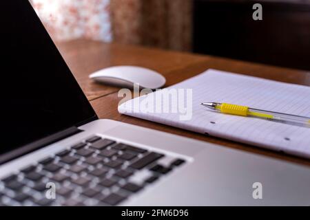 notebook with a mouse on a table Stock Photo