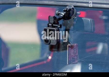 Riga, Latvia - May 01, 2021: action camera GoPro Max for video recording mouonted on the car front window Stock Photo