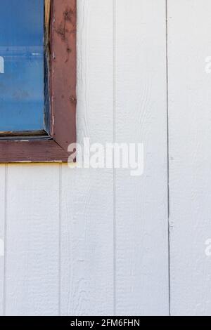 White grey wooden texture painted background of wood plank wall and part of an old rustic window Stock Photo