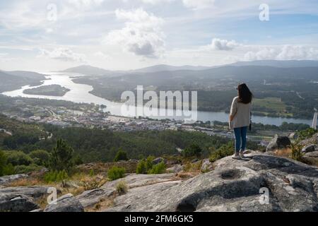 Caucasian woman seen from a viewpoint, Vila Nova de Cerveira Portugal Stock Photo