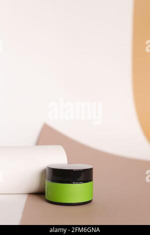 Blank cosmetic products on neutral background. Green Place for your text. Stock Photo