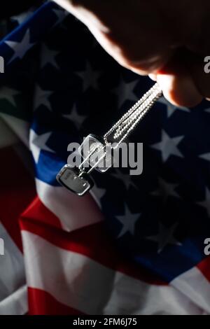 Soldier's token on American flag background Stock Photo