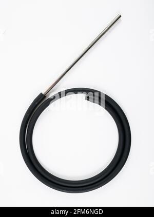 Rubber black hookah hose with a metal tube on a white background. Stock Photo