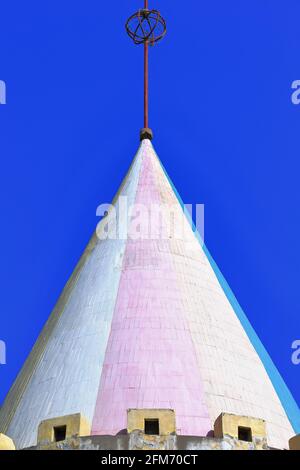 Conical pink-white-blue-yellow brick roof on turret-building in Ganquan Park. Zhangye-Gansu-China-1309 Stock Photo