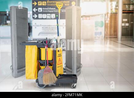 Cleaning cart put on the floor prepare for cleaning at the public area, Due to the Covid19 epidemic pandemic, that must be clean every hour. Stock Photo