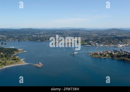 Aerial photograph of  Esquimalt Harbour and View Royal. The Fisgard Lighthouse is on the left and the dockyard on the right Victoria, Vancouver Island Stock Photo