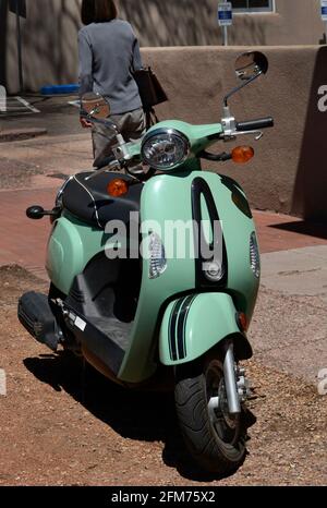 An electric Compagne motor scooter parked in Santa Fe, New Mexico. Stock Photo
