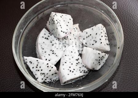 Closeup Image Of White Sliced Dragon Fruit In A Glass Bowl Stock Photo