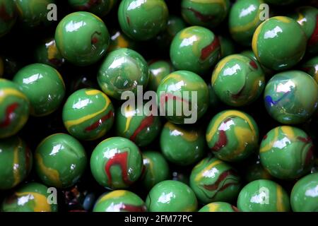 Handful of Red Marbles Stock Photo - Alamy