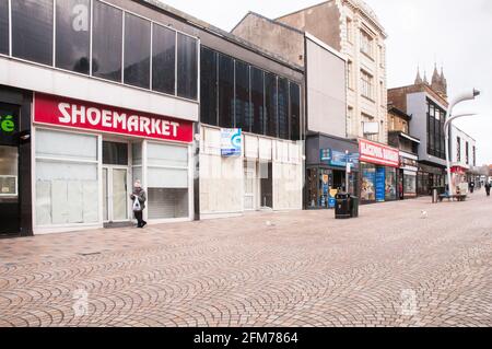 Closed and empty shops and almost deserted church street in town centre during Covid 19 lock down in Blackpool Lancashire England United Kingdom Stock Photo