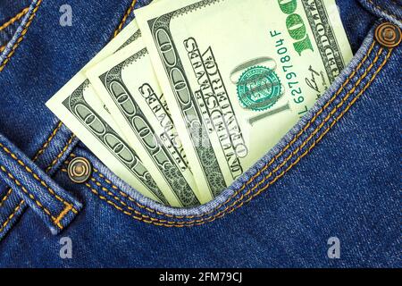 100 dollar banknotes in blue jeans pocket close up, business and finance background concept Stock Photo