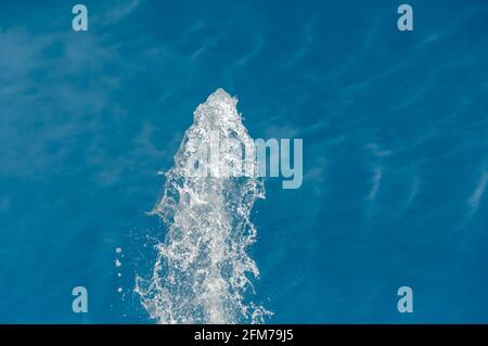 Splashing water from a fountain. Fountain in the open air, on the street. Drops of water Stock Photo