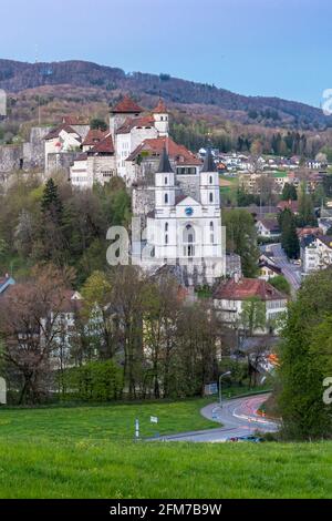 Aarburg, Switzerland - April 23, 2021: The castle of Aarburg in Switzerland and a reformed church are located high above the town Aarburg on a steep, Stock Photo