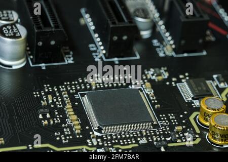 Electronic micro chip on hi tech pc motherboard,computer components chip Stock Photo