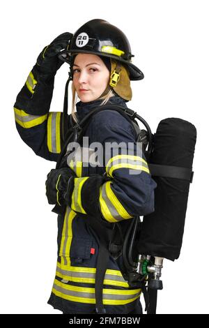 Woman in uniform of firefighter posing in profile with air tank Stock Photo