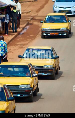 Yellow taxis in a row in Yaounde II Stock Photo