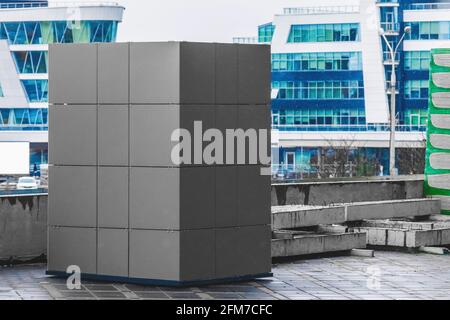 A sample of facade materials at a construction site against the background of modern city buildings with snow in winter. Stock Photo