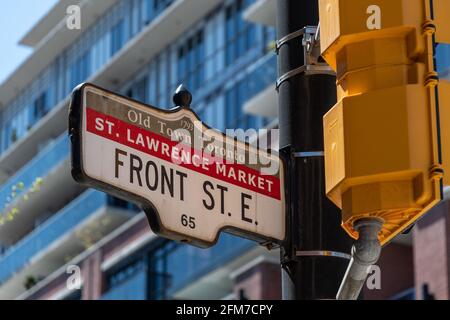 Traffic signpost marking Front Street East in the Old Town district of Toronto, Canada. The object is seen close to the Saint Lawrence Market Stock Photo